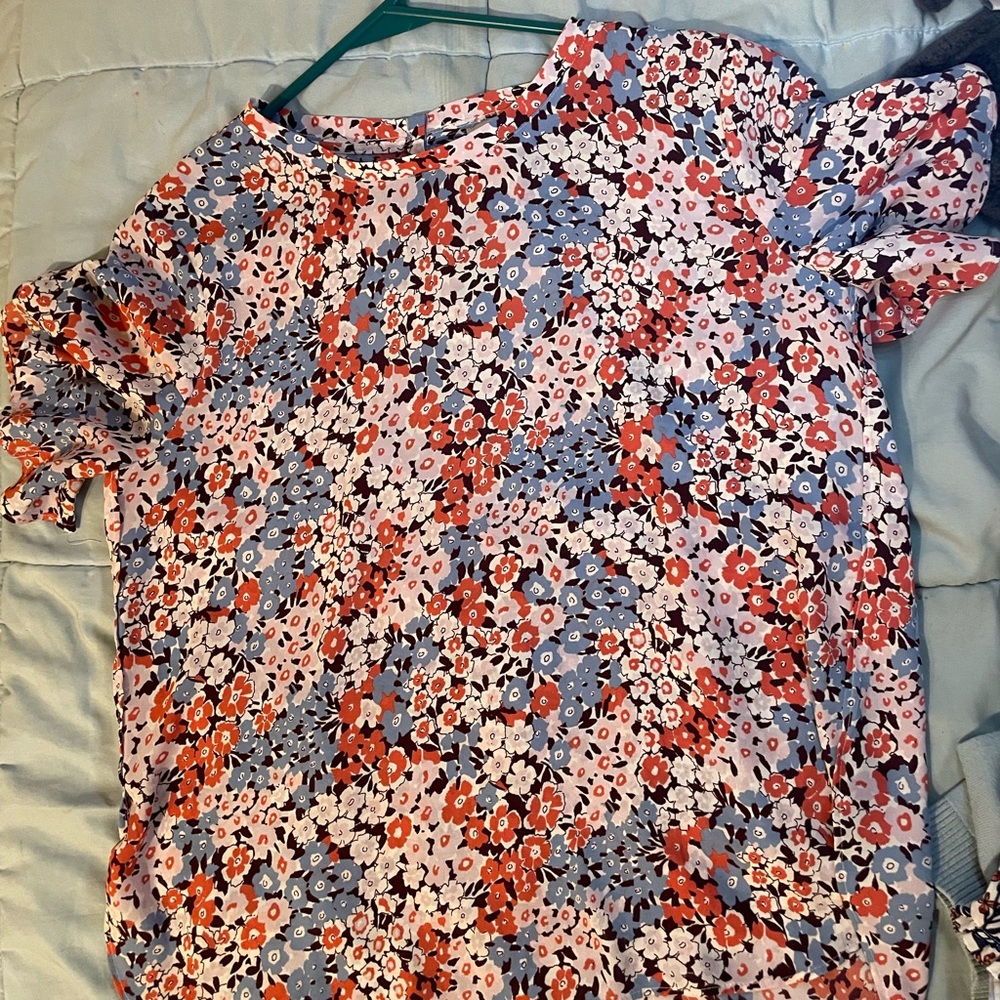 Blue, pink, and a lilac purple floral blouse.
